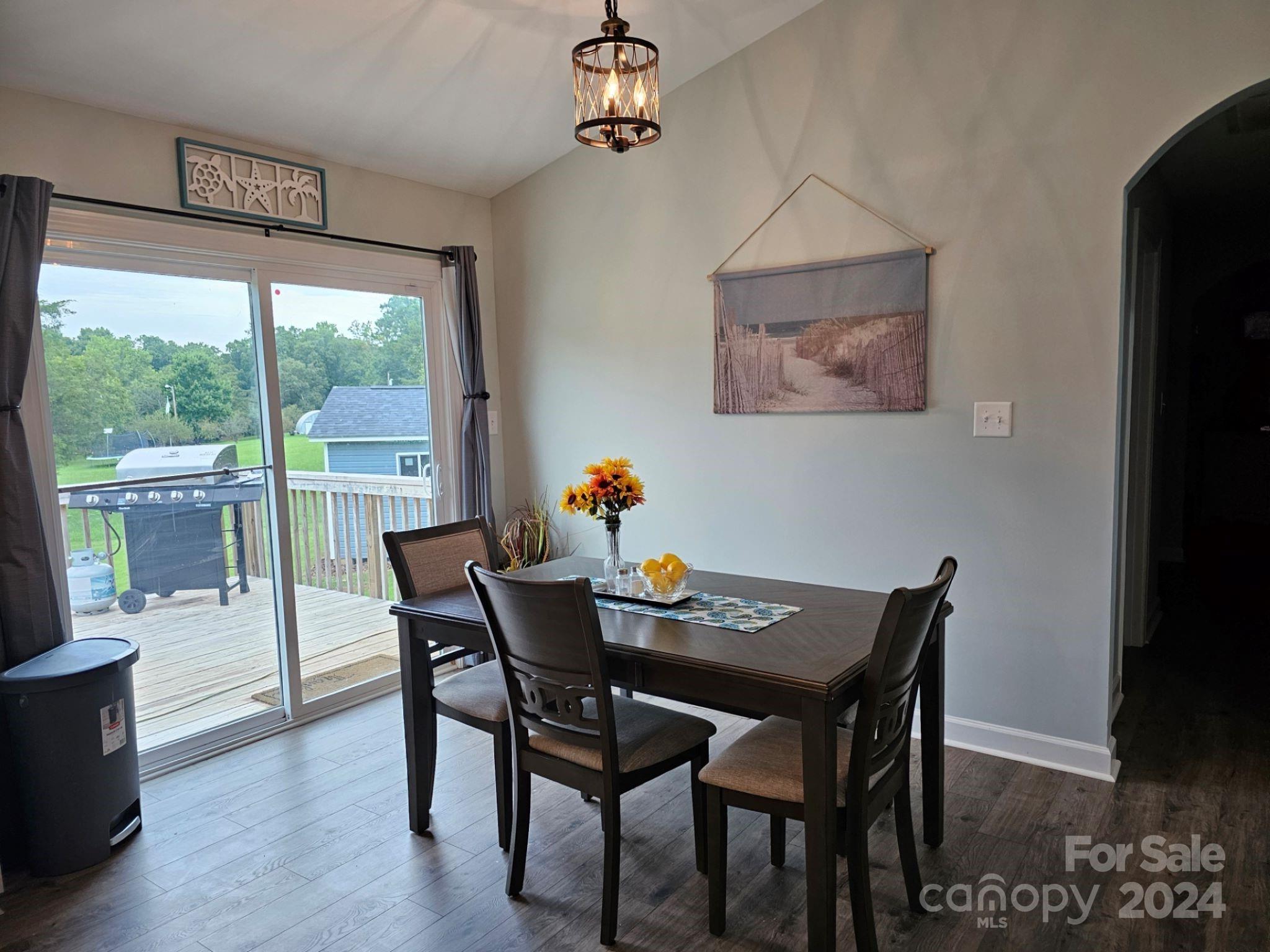 302 Flint Hill Road Cherryville, NC 28021 - Photo 9 of 32 a view of a dining room with furniture window and wooden floor