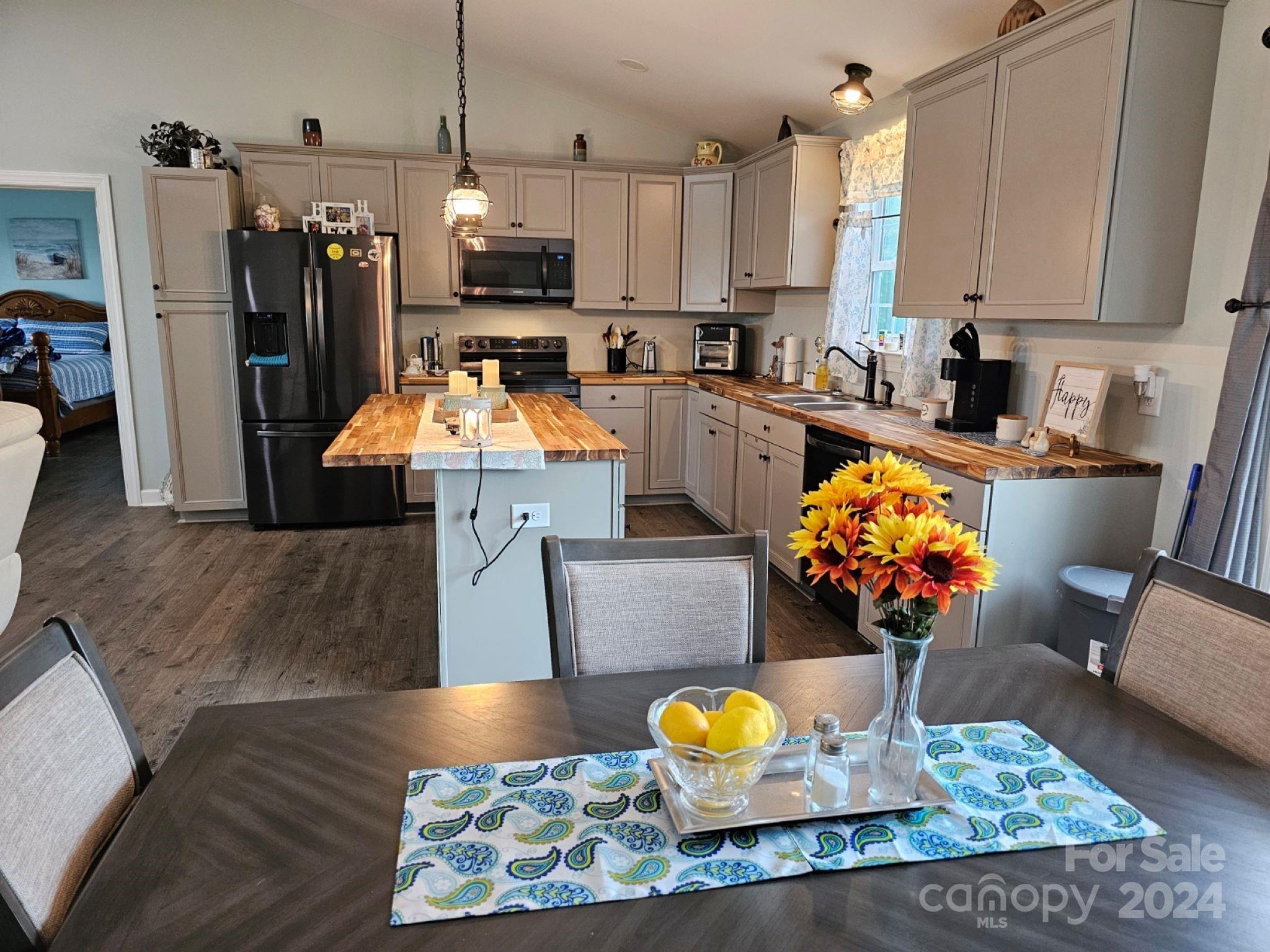 302 Flint Hill Road Cherryville, NC 28021 - Photo 10 of 32 a view of kitchen living space with furniture and wooden floor