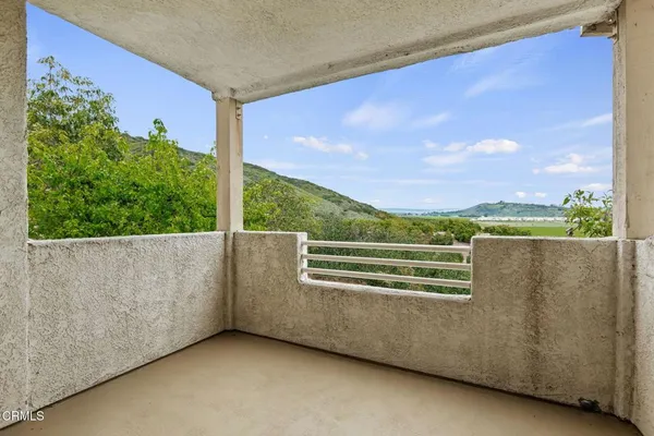 a view of outdoor space swimming pool and mountain view in back
