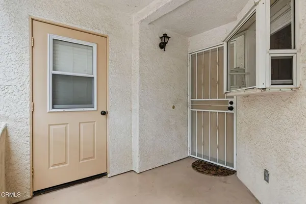 a view of a door with wooden floor