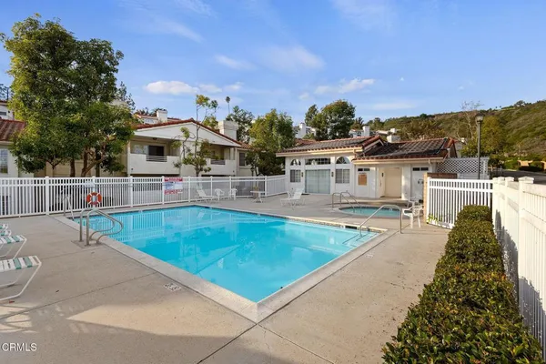 swimming pool view with a outdoor seating