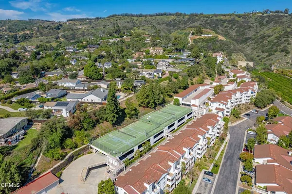 an aerial view of residential houses with outdoor space