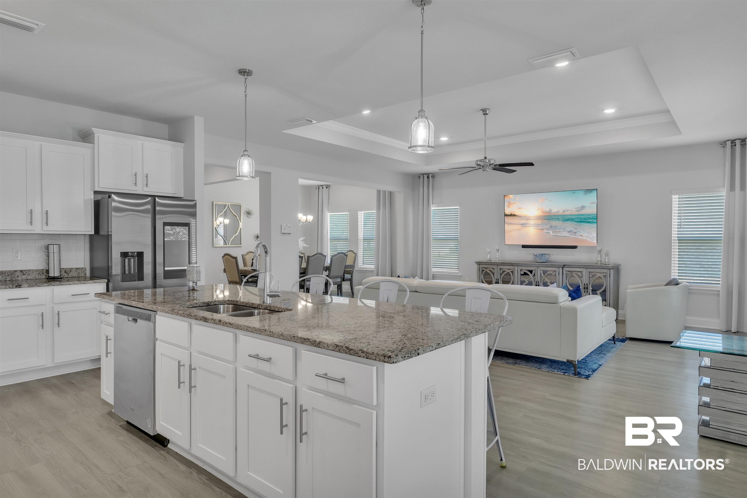 27862 Jade Court Daphne, AL 36526 - Photo 12 of 33 Kitchen featuring a raised ceiling, visible vents, appliances with stainless steel finishes, and light wood finished floors