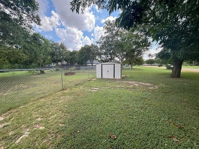 a backyard of a house with lots of green space