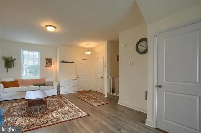 a living room with furniture and a rug