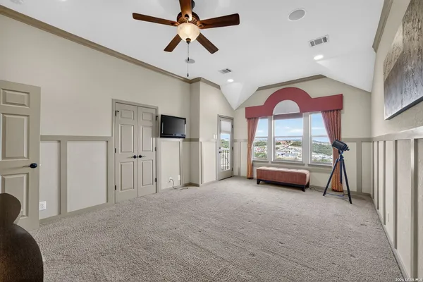 a view of empty room with a flat screen tv