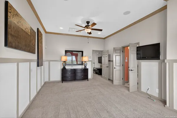 a view of a livingroom with furniture and a flat screen tv