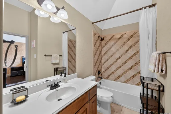 a bedroom with a bed and a table