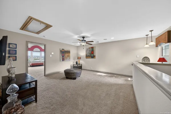 a view of a livingroom with furniture and a flat screen tv