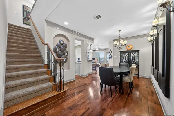 a view of a dining room with furniture and wooden floor