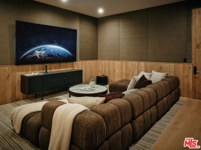 a living room with furniture and a lamp