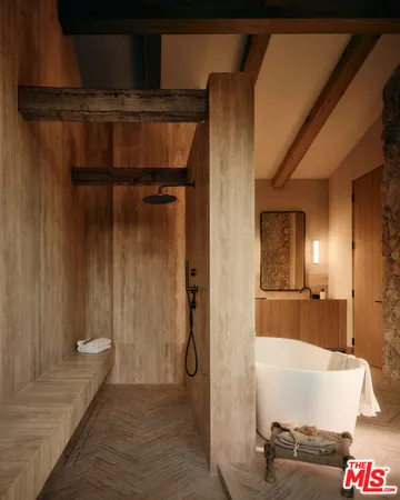 a bathroom with a tub and shower