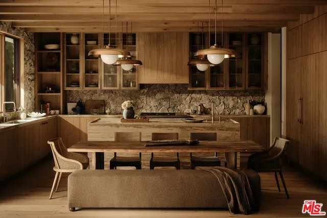 a dining area with granite countertop a couch and chairs