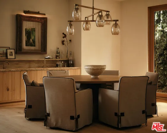 a living room with furniture and a mirror