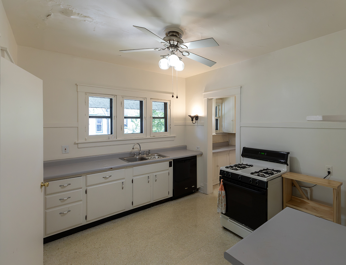 202 Ridgeland Avenue, Unit 2 Oak Park, IL 60302 - Photo 11 of 34 a kitchen with granite countertop a sink cabinets and stainless steel appliances