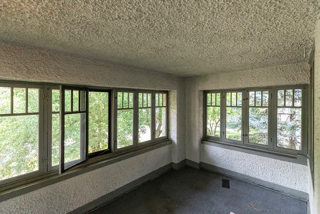 a view of an empty room with a window