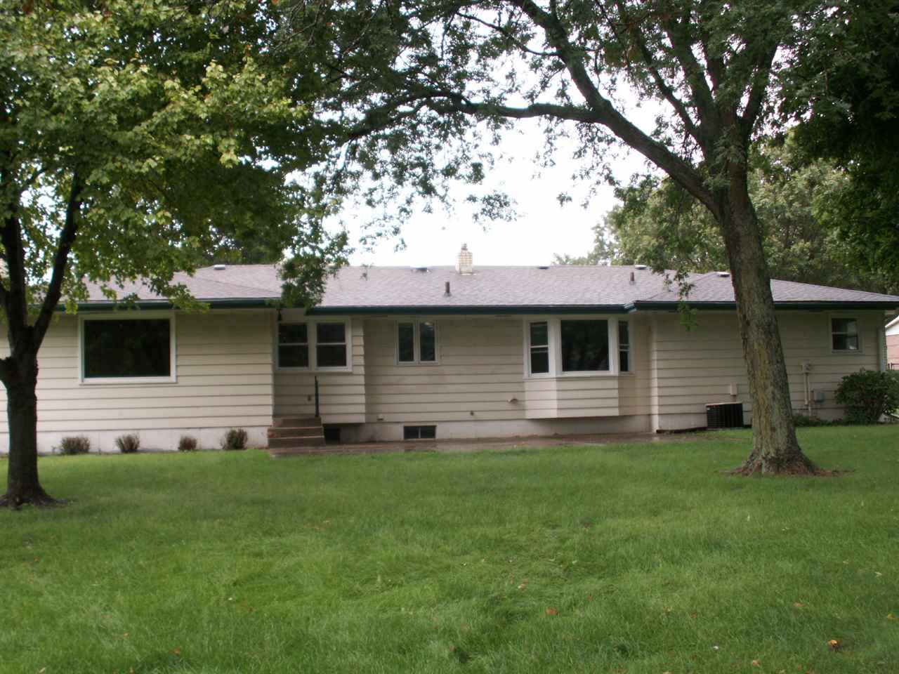 5407 Brookview Road Rockford, IL 61107 - Photo 2 of 16 a front view of house with yard and green space
