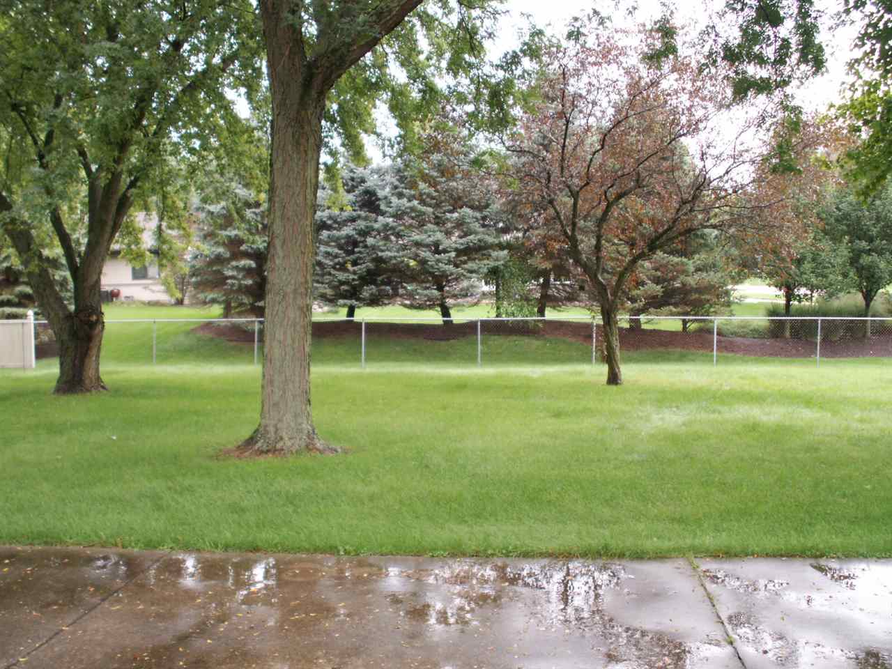 5407 Brookview Road Rockford, IL 61107 - Photo 3 of 16 a view of a backyard with green space