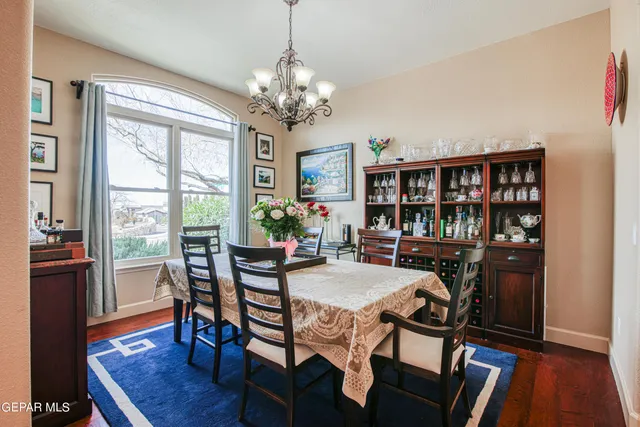 a dining room with furniture and window