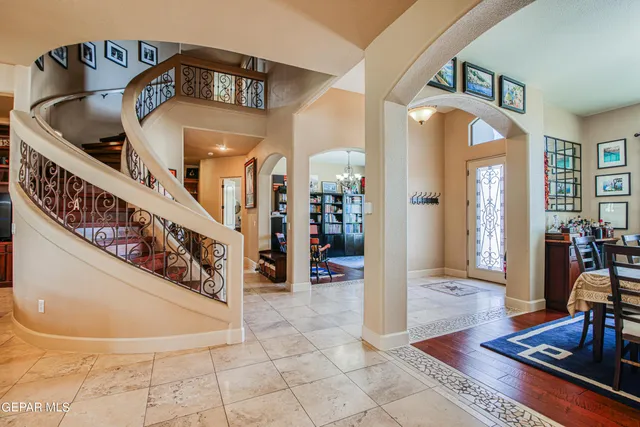 a room with furniture and book shelf