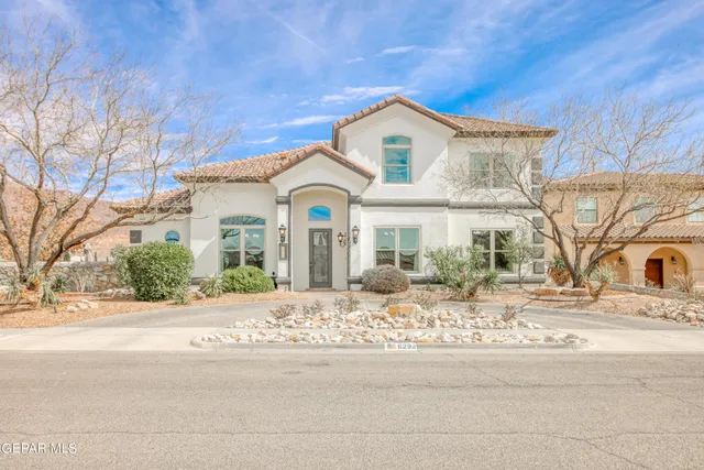 front view of a house with a ocean view and mountain view