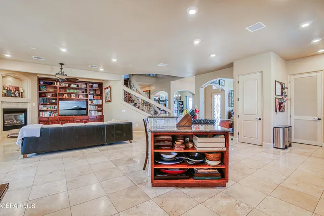 a bathroom with a granite countertop toilet sink and a bathtub