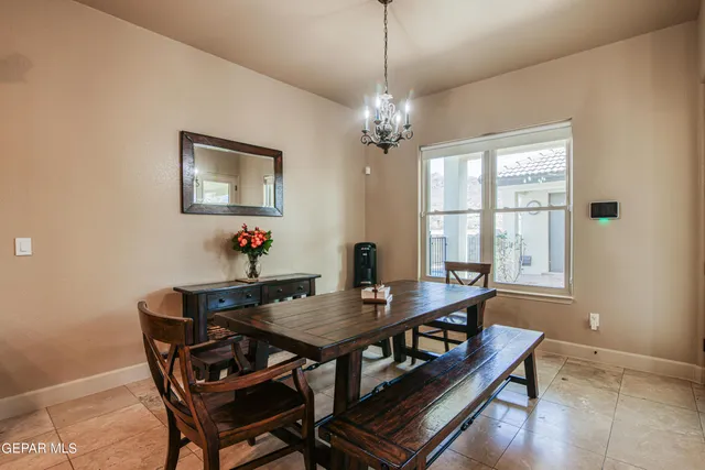 a view of a hallway with wooden floor and a bathroom
