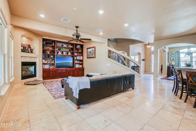 a bedroom with furniture and a chandelier