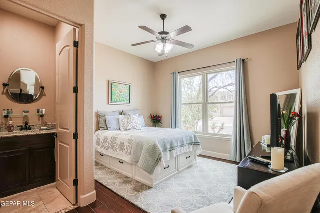 a bedroom with a bed and a dresser in it