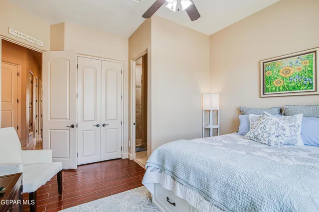 a bedroom with a bed and a book shelf