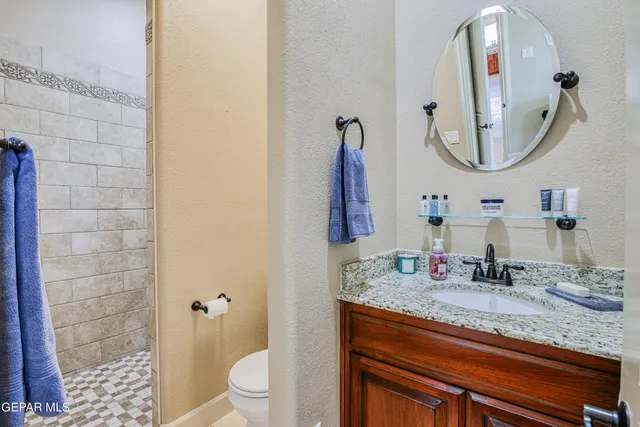 a bedroom with furniture and wooden floor