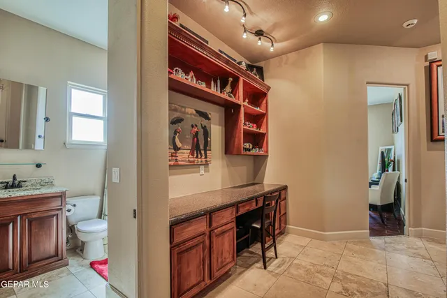a utility room with lots of different colored cloths