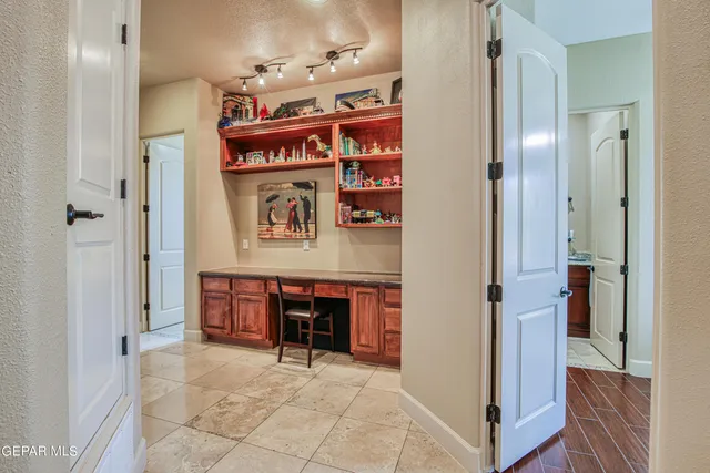 a bathroom with a tub a sink and a mirror
