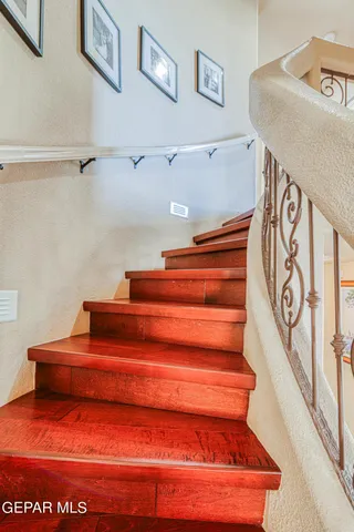 a view of a balcony with wooden floor and city view
