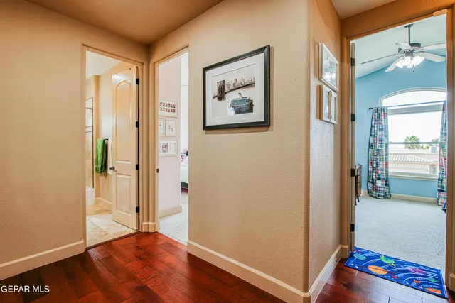 a view of a porch with furniture and floor to ceiling window