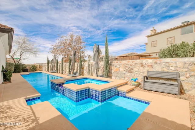 a room with lots of wooden furniture and a rug