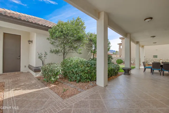 a living room with furniture a dining table and chairs