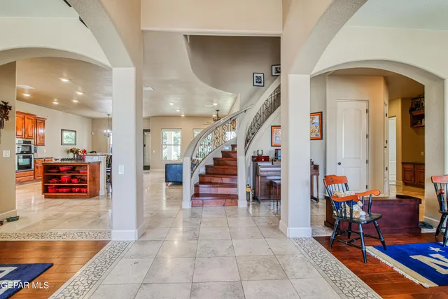 a large kitchen with stainless steel appliances lots of counter space and a sink