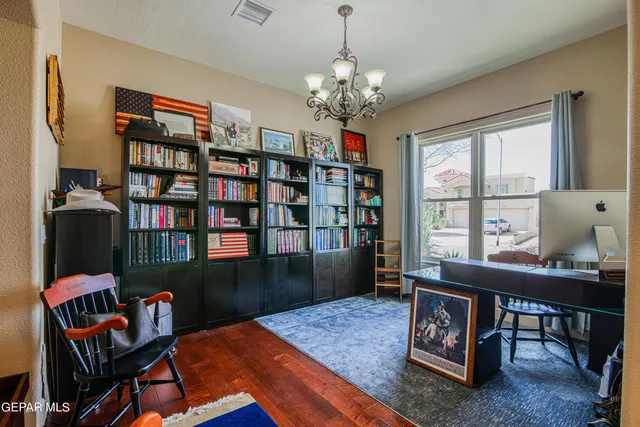 a kitchen with granite countertop a stove top oven and cabinets