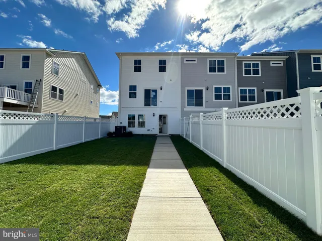 a view of a back yard of the house