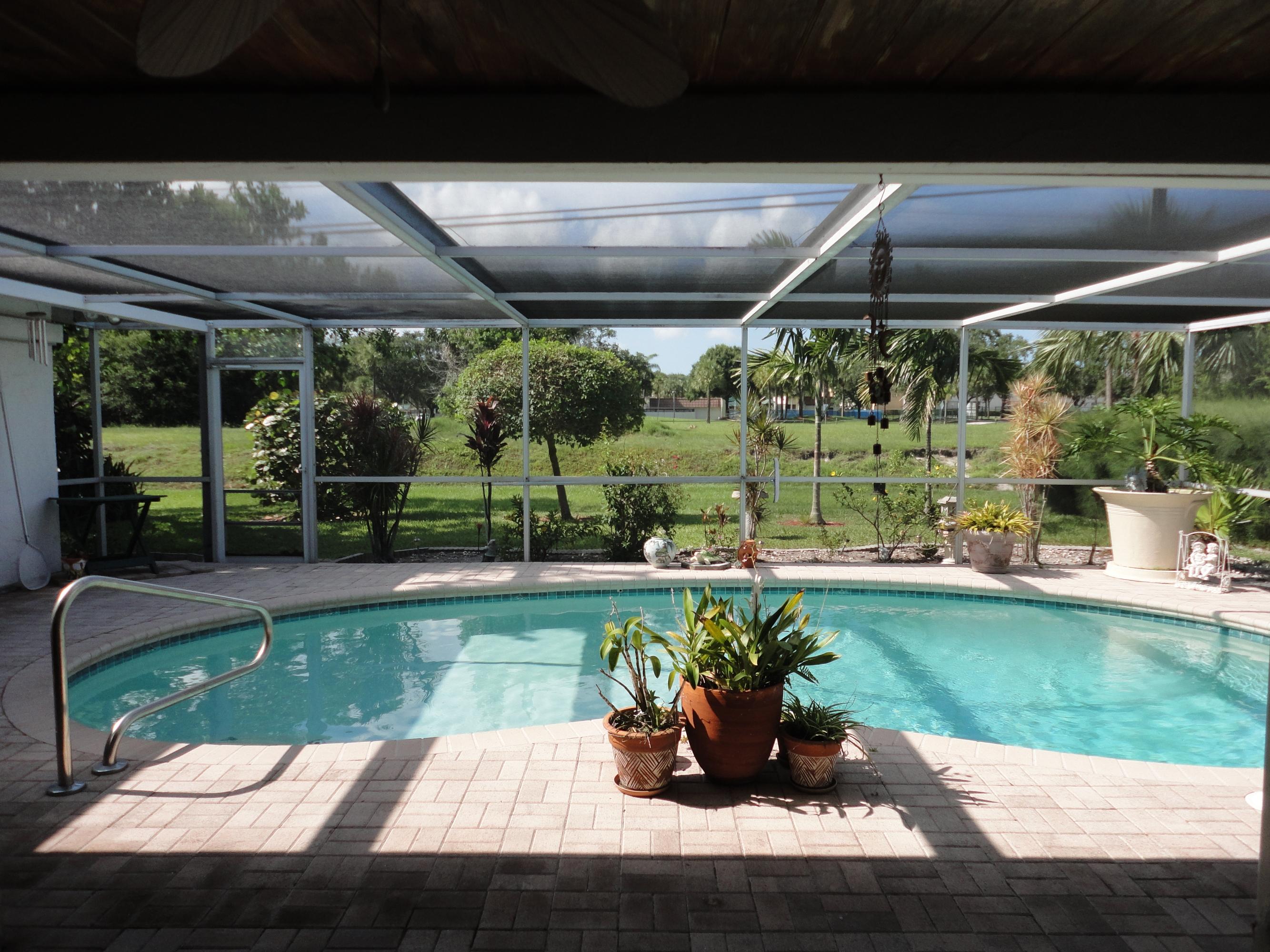 1349 Northwest 7th Street Boca Raton, FL 33486 - Photo 27 of 37 Pool/Screened Patio