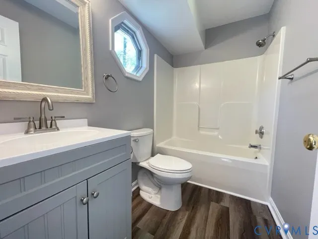 a bathroom with a sink a toilet and a bathtub