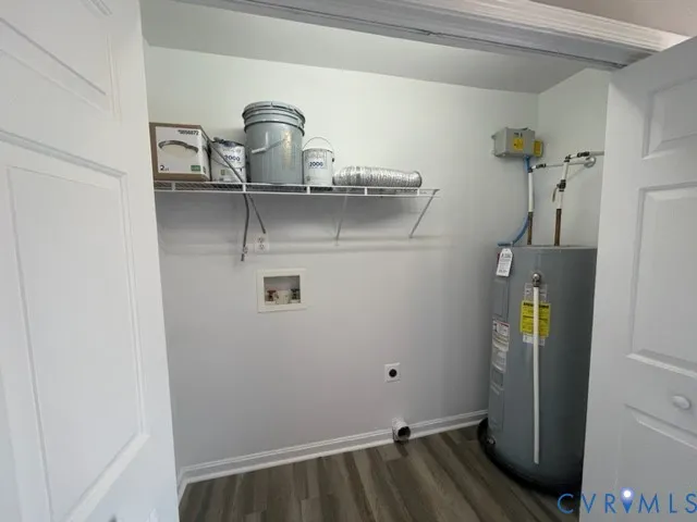 a view of storage and utility room with closet