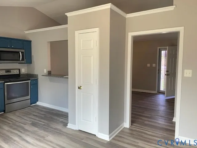 a view of a kitchen with a sink and a stove top oven