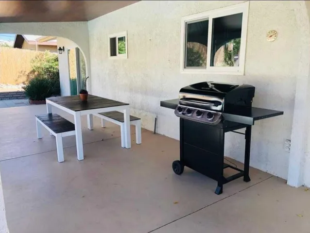 a dining room with furniture and window