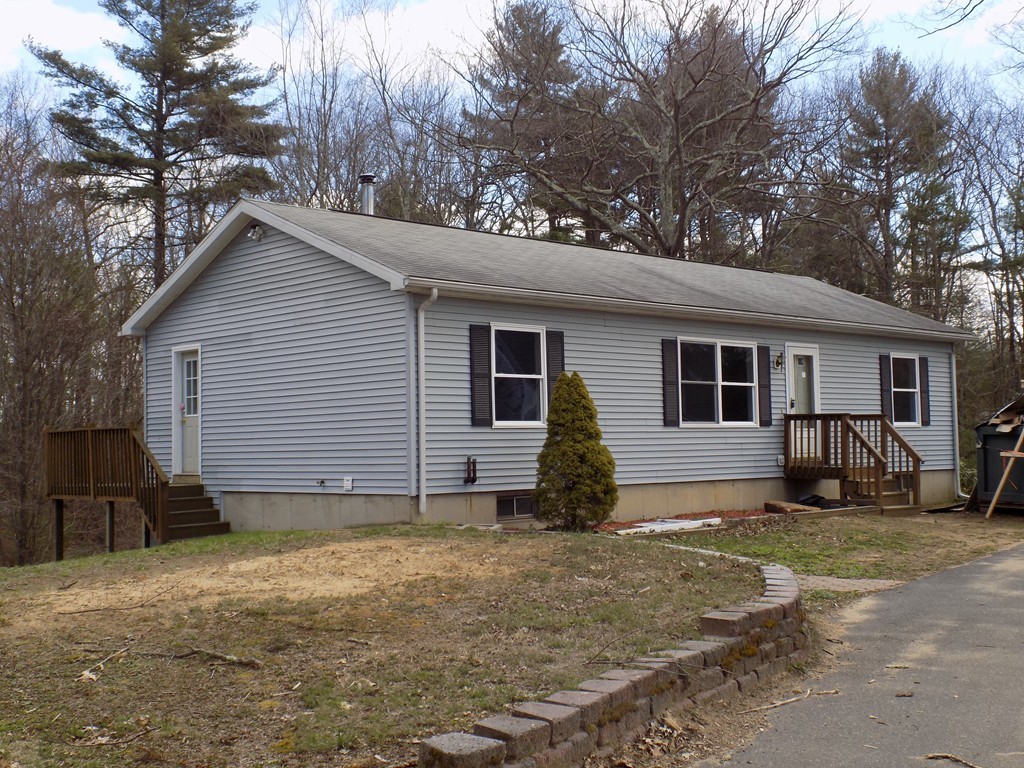 167 Union Road Wales, MA 01081 - Photo 1 of 16 a house that has a tree in front of it