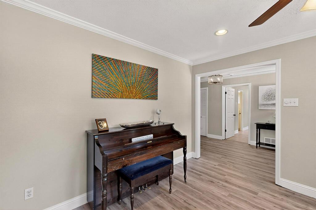 11717 Welch Road Dallas, TX 75229 - Photo 13 of 40 a room with furniture and wooden floor