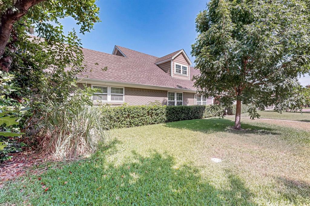 11717 Welch Road Dallas, TX 75229 - Photo 3 of 40 a front view of a house with a yard and garage