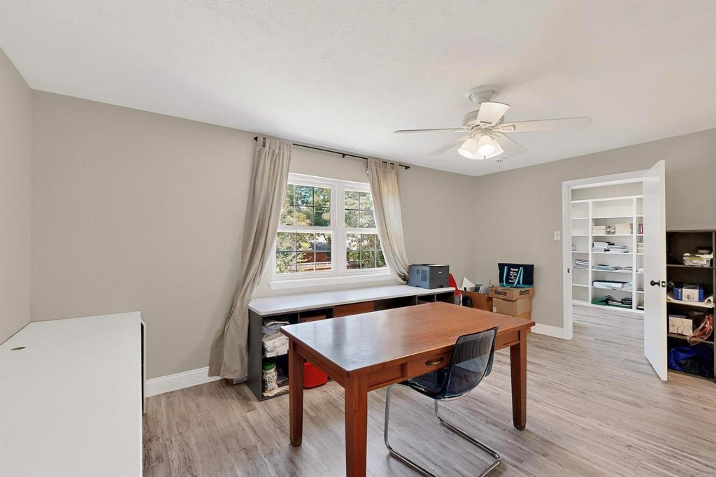 11717 Welch Road Dallas, TX 75229 - Photo 32 of 40 a view of a workspace with furniture and a window