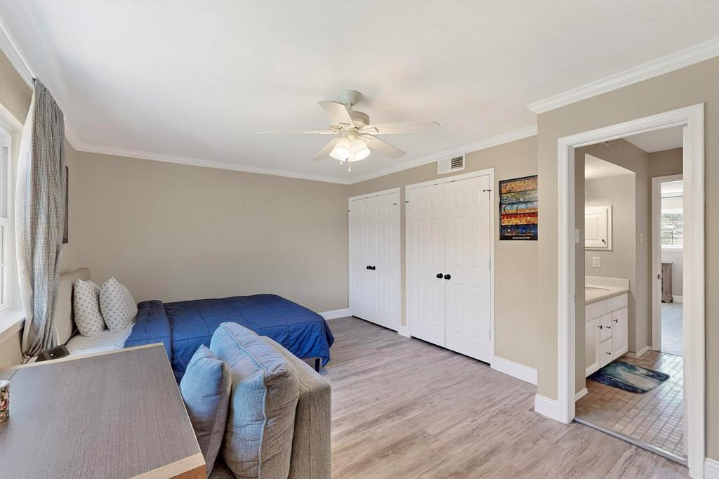 11717 Welch Road Dallas, TX 75229 - Photo 34 of 40 a living room with wooden floors and ceiling fan